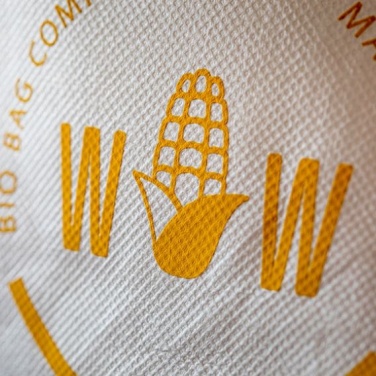 Logo trade reklaamtooted foto: Seljakott maisitärklisest, valge